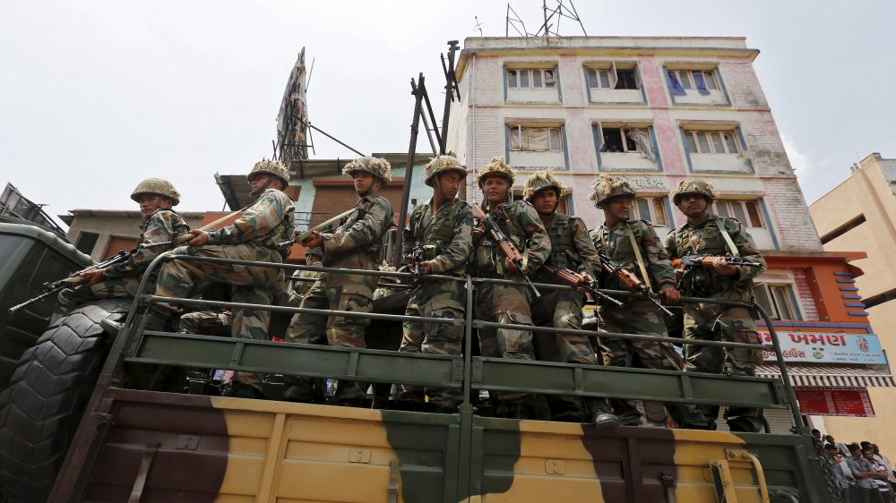 Indian army soldiers patrol the streets of Ahmedabad