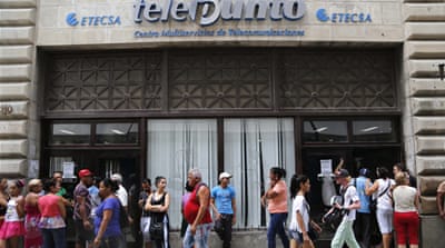 Cuban authorities have launched public wi-fi hotspots along a main avenue as a first step in government promise to gradually roll out such connectivity options [Desmond Boylan/AP]