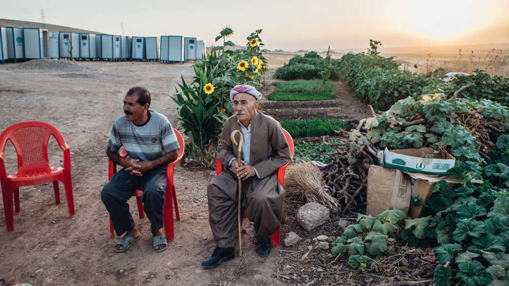 Due to a lack of space and overcrowding inside the camps, some displaced Yazidis live in semi-built houses and structures in the valleys outside the camps [Andrea DiCenzo/Al Jazeera]