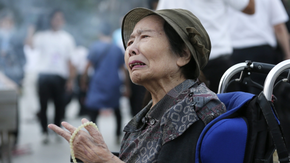A Hiroshima resident offers a prayer for victims on the 70th anniversary of the 1945 Hiroshima atomic bombing [EPA]