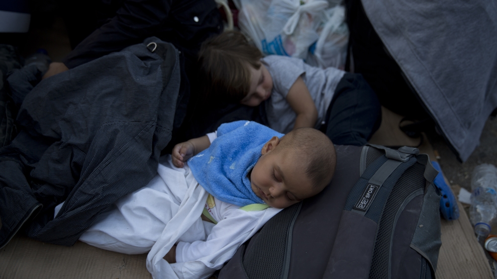 EU states are divided on a quota system, which allocates refugees to different member countries [AP]