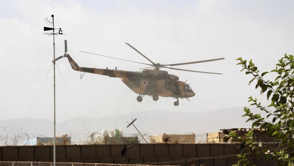 An Afghan helicopter carries Afghan special forces as they arrive for a battle with the Taliban in Kunduz city, northern Afghanistan