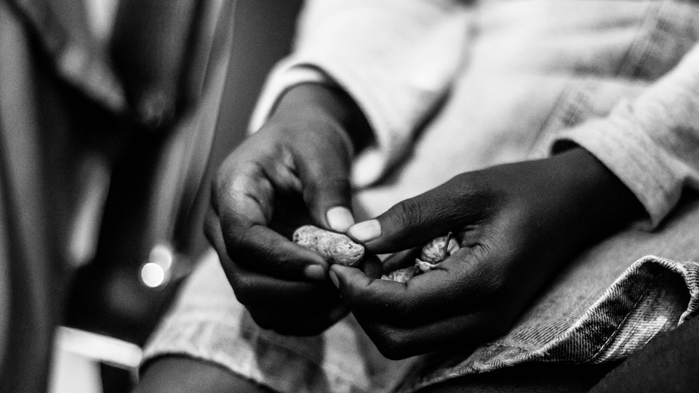Dami wears the same denim skirt she wore on the day she was attacked. [Logor Olumuyiwa Adeyemi/Al Jazeera]