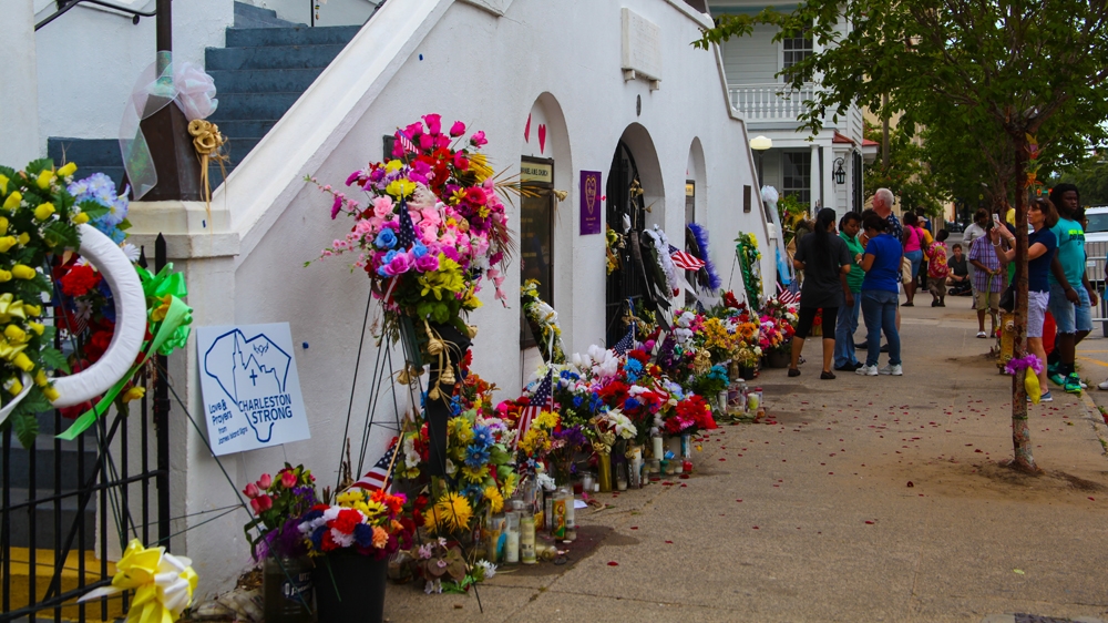 A memorial by the Emanuel AME Church, where nine African Americans were shot during Bible study [Allison Griner]
