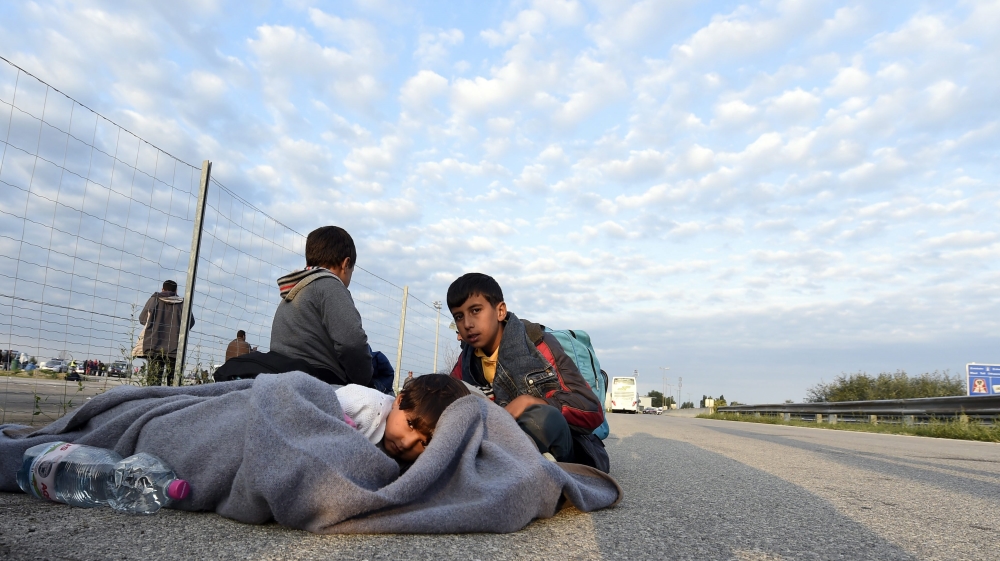 Refugees arrive at the Austrian border town of Nickelsdorf. Both Germany and the Czech Republic are tightening border controls [EPA]