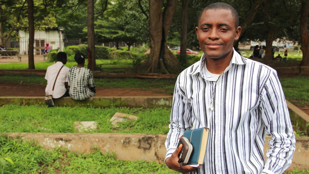 Sunday Olawale Olaniran stumbled across Michael Taiwo Akinkunmi 's story in 2006. He says the older man's plight at the time brought him to tears. But his role in shaping Nigerian identity has since been more broadly recognised [Femke van Zeijl/Al Jazeera]