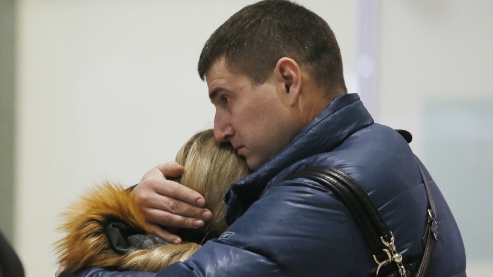 Relatives react after a Russian airliner crashes