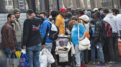 Migrants, mainly from Syria, prepare to board a train headed for Sweden, at Padborg station in southern Denmark