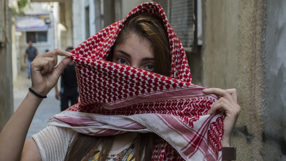 Like her mother and aunts before her, Nour Hussein has taken to the streets during this most recent uprising [Abed al Qaisi/Al Jazeera]