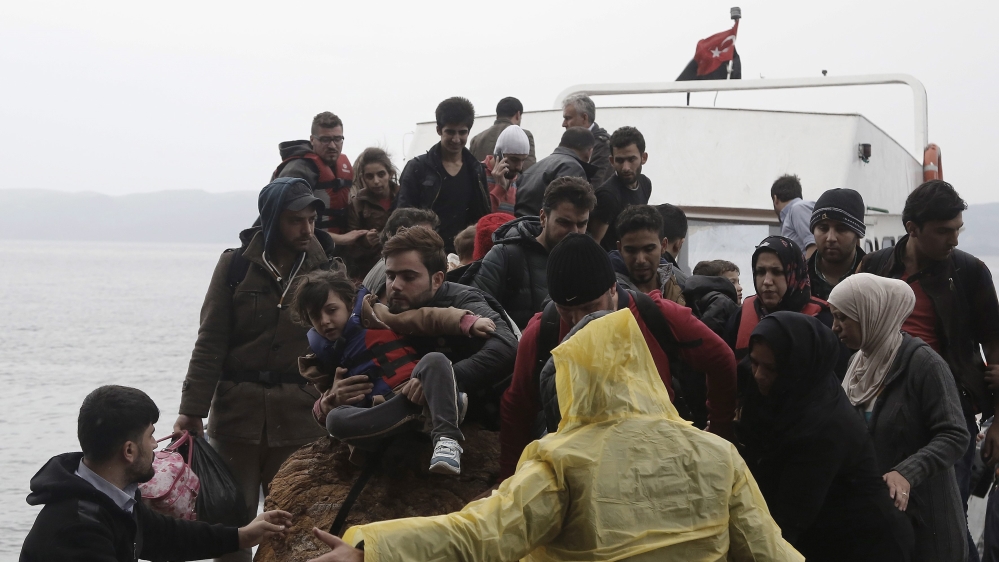 Refugees and migrants arrive on the Greek island of Lesbos