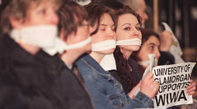 Gagged students protest outside the Nigerian Embassy in London on Ken Saro-Wiwa's death sentence in 1995 [AFP/Getty Images]