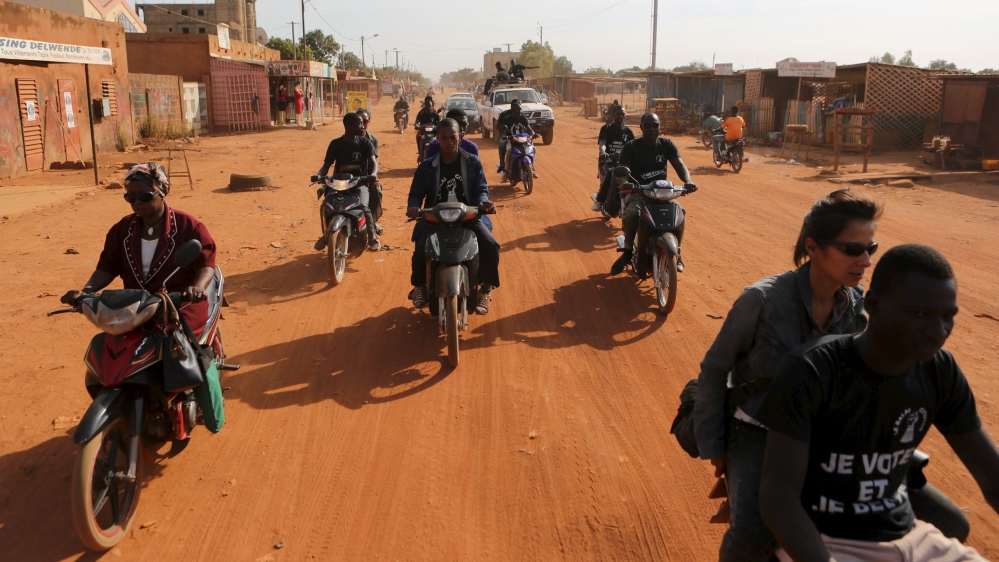 Members of civil society group Le Balai Citoyen prepare to hand out flyers encouraging people to vote in Ouagadougou [Joe Penney/Reuters]