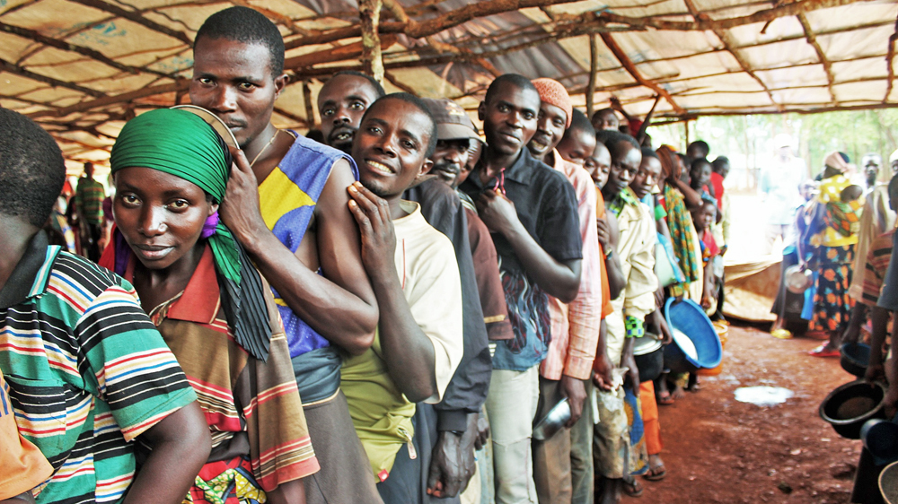 New refugee arrivals queue for food at Nduta camp [Tendai Marima/Al Jazeera]