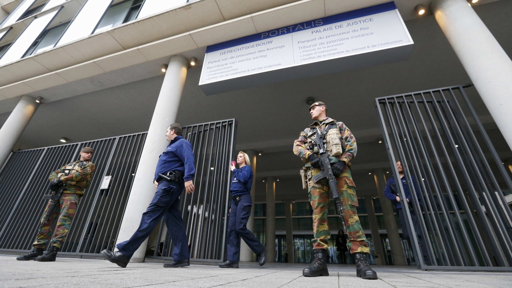 Armed soldiers stand guard outside courthouse in Brussels