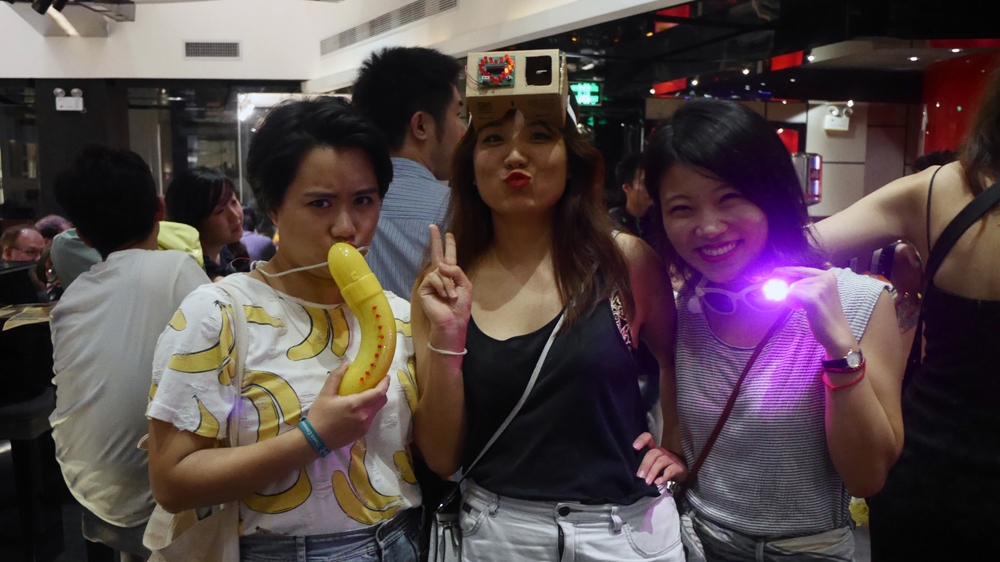 Partygoers at a Maker Faire event wear homemade Arduino accesories [Matan Rochlitz/Al Jazeera]