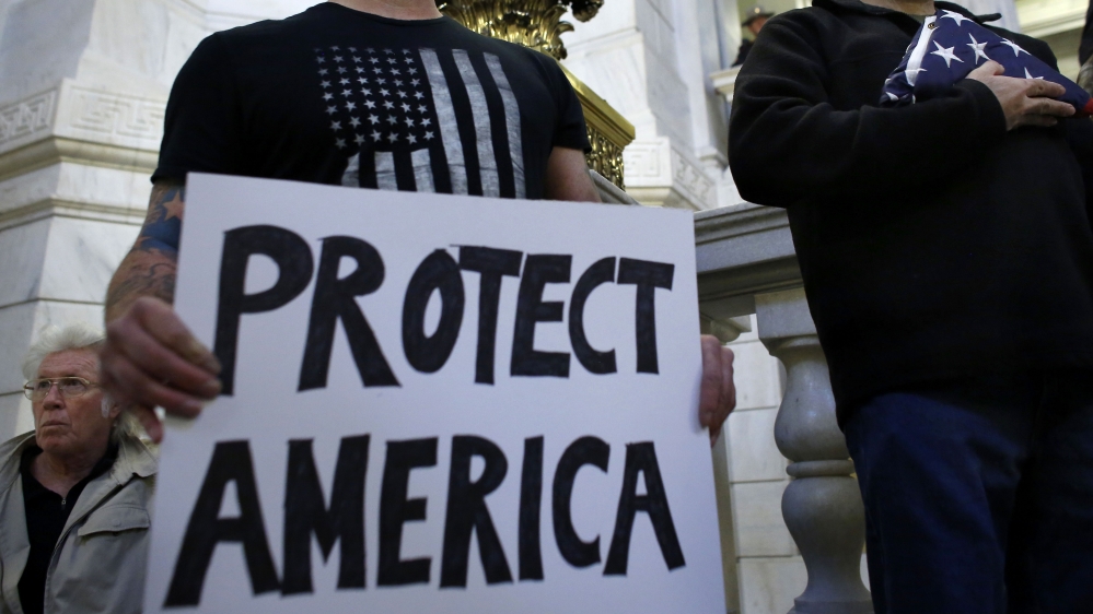 Demonstrators protest against letting Syrian refugees enter Rhode Island after the terror attacks in Paris [Steven Senne/The Associated Press]