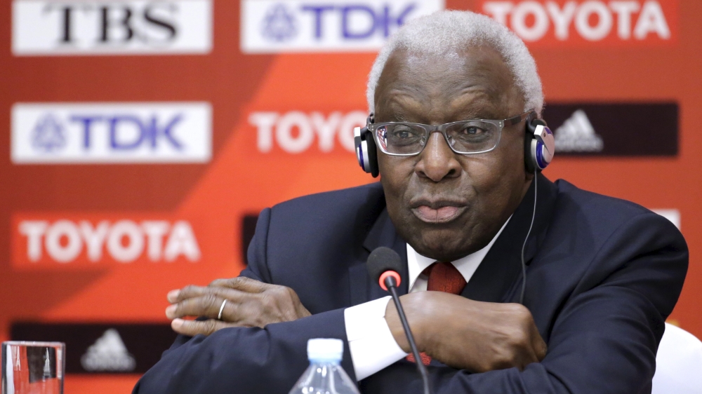 File photo of then-outgoing President of IAAF Diack attending a news conference in Beijing