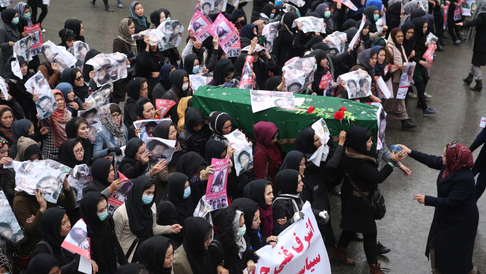 Afghan women carry the coffin of a 9 year-old girl as thousands march in the Afghan capital of Kabul on Wednesday [AP]