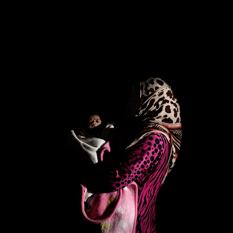 Twenty-eight-year-old Ghazzieh is from Idlib and has been in Lebanon for four months. She has seven children. Her youngest, Sham, is 40 days old. Sham had to stay in an incubator for five days. So far, they have only been able to pay for half of the hospital expenses. The hospital has retained her ID until she pays the remainder [Felipe Jacome/Al Jazeera] 