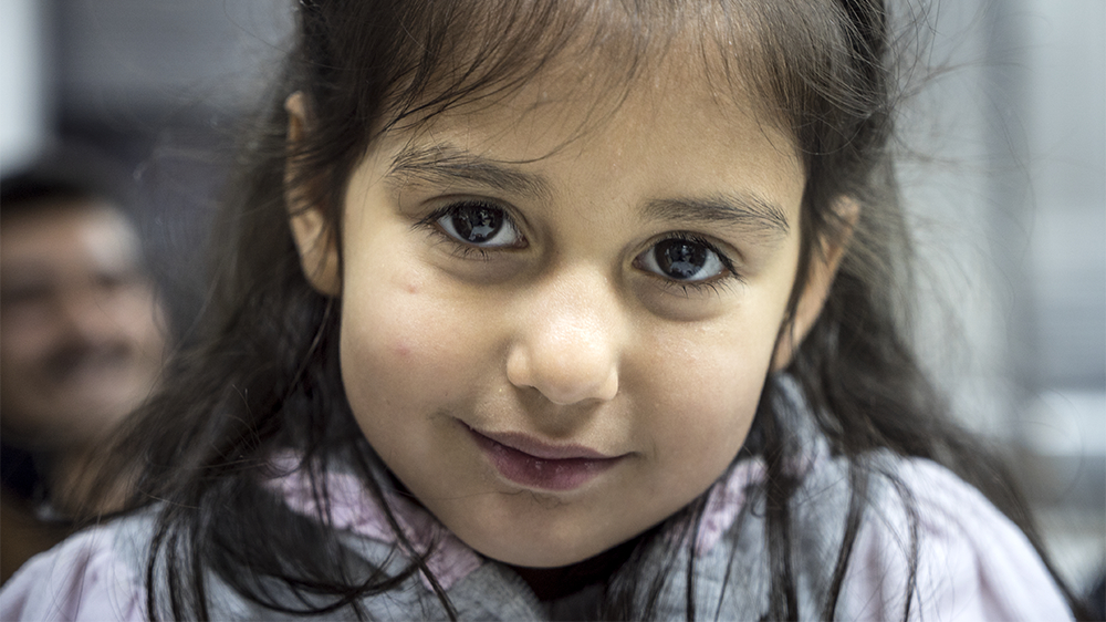 Javid's daughter and her two brothers cried throughout the four-hour boat ride from Turkey to the Greek island of Lesbos [Sorin Furcoi/Al Jazeera] 