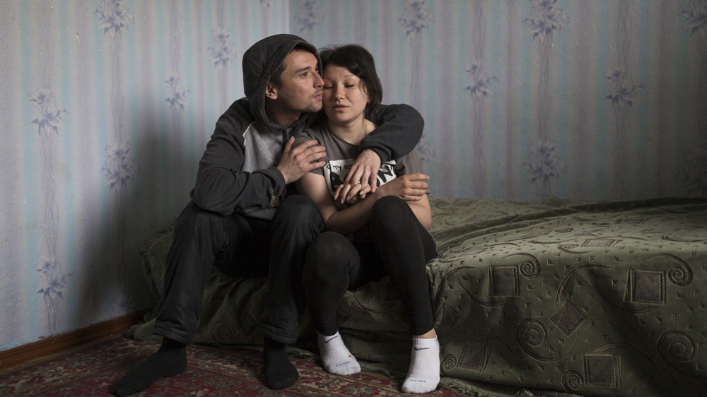 Twenty-eight-year-old Renat and 20-year-old Regina would like to get married, but have not been able to save enough money to do so, even though Renat has worked in, mostly illegal, mines for the past eight years. [Janos Chiala and Tali Mayer/Al Jazeera] 