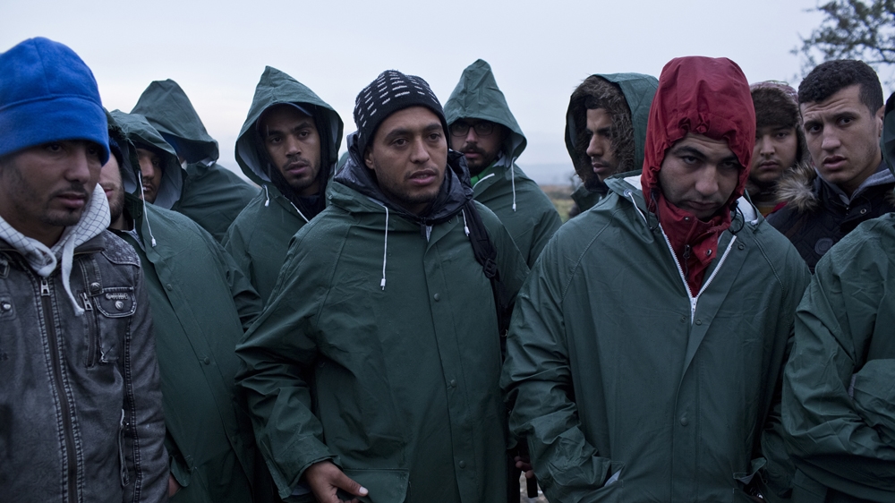 A group of Moroccan refugees protest against being denied passage into Macedonia. On December 3, a young Moroccan man was electrocuted trying to cross the newly erected fence along the Greece-Macedonia border [Anna Psaroudakis/Al Jazeera]