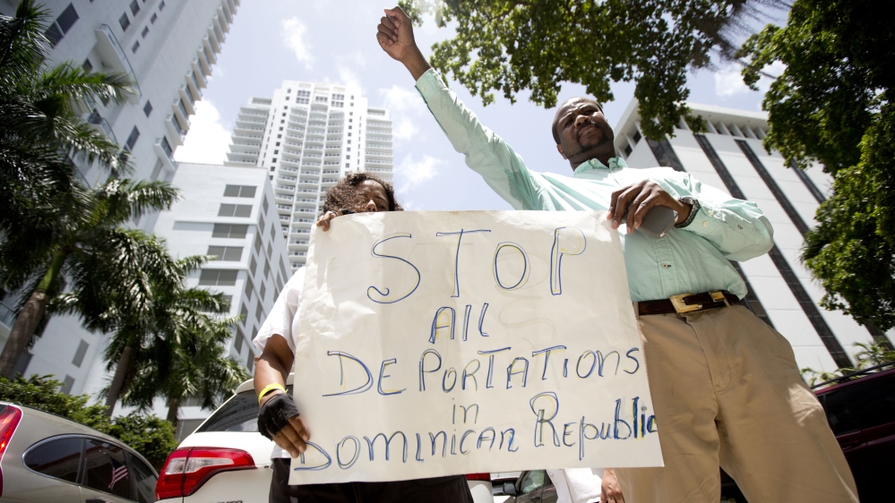 People protest in Miami in July 2015, against Haitians and Dominicans becoming stateless under a Dominican Republic crackdown on undocumented immigrants [AP]