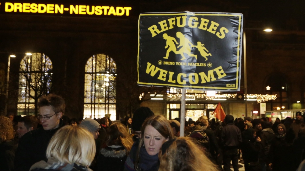 Activists hold a counter demonstration against Pegida in the German city of Dresden [Sebastian Willnow/EPA]