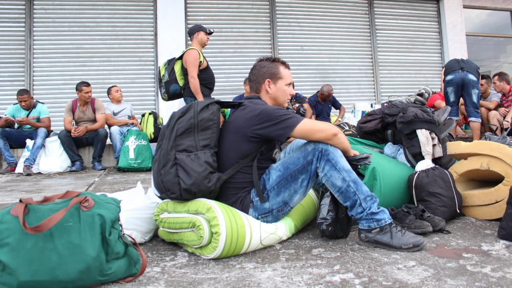 Cuban migrants wait to be accommodated in hotels in Panama as they look forward to move to Costa Rica [Marcelino Rosario/EPA]
