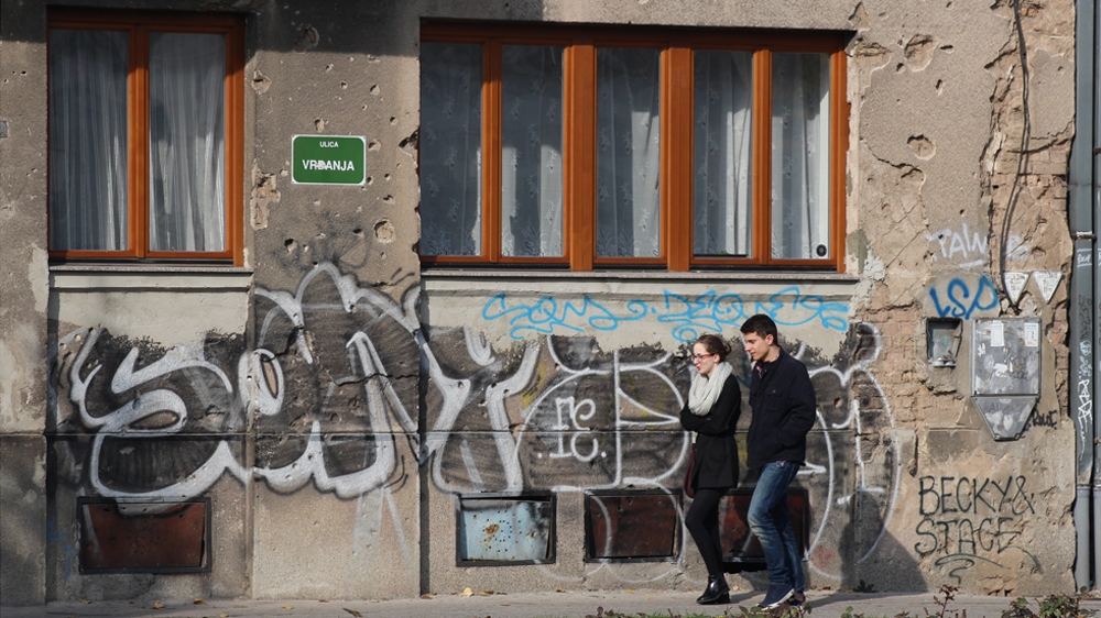 In Sarajevo, residents are surrounded by reminders of the bloody 1990s ethnic conflict [Drazen Huterer/Al Jazeera]