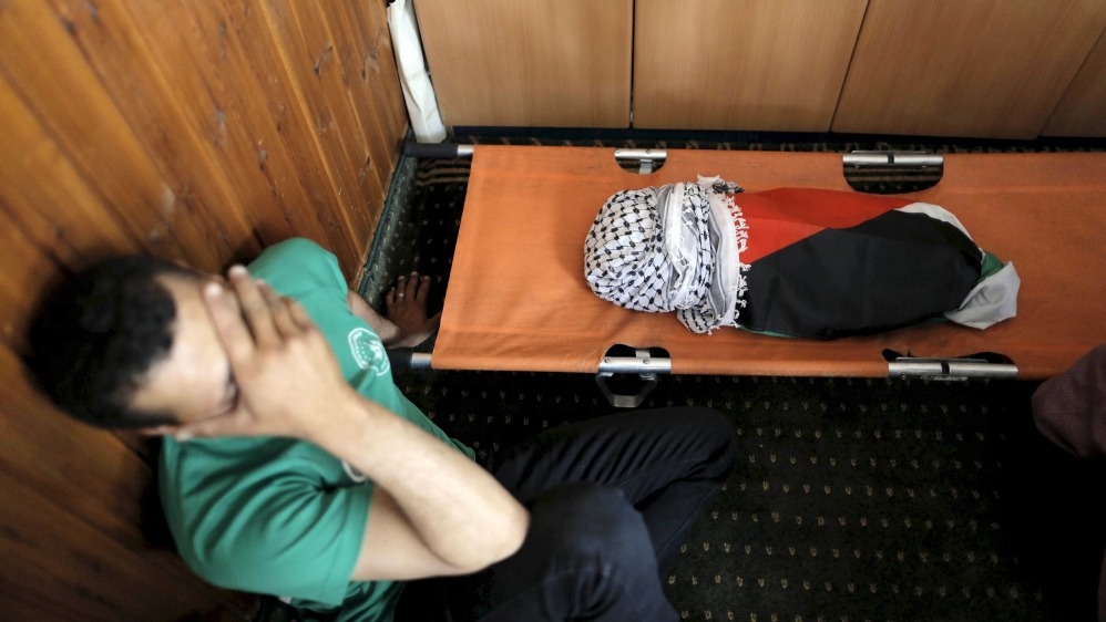 File picture shows a mourner reacting next to body of 18-month-old Palestinian baby Ali Dawabsheh, who was killed after his family''s house was set to fire in a suspected attack by Jewish extremists in