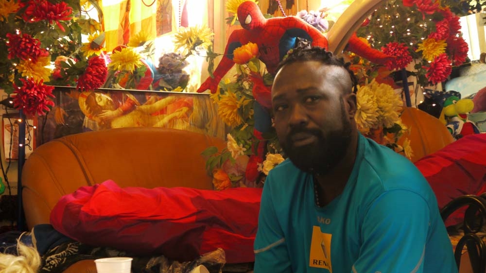 Samuel is from Cameroon and spends his day reading and studying. At night, he walks