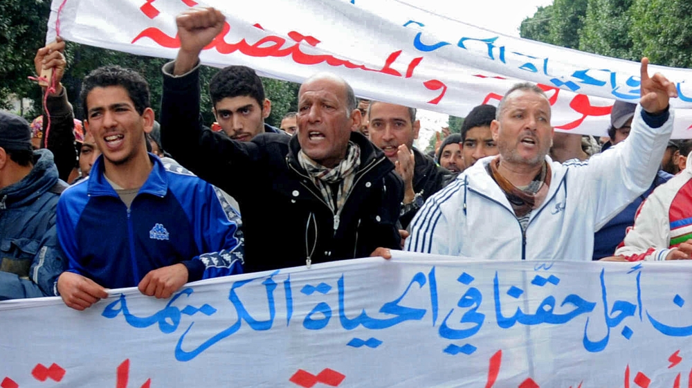 Tunisia has imposed a nationwide curfew amid growing unrest over unemployment [Riadh Dridi/AP]
