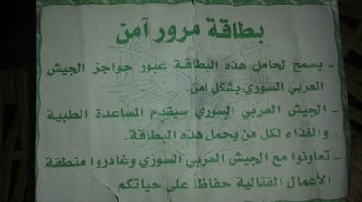 'Card for safe passage': This note outlines the requirements by the carrier to slowly approach the army checkpoints without any weapons, and they will be given medical assistance and food [Salim al-Shami/Al Jazeera]