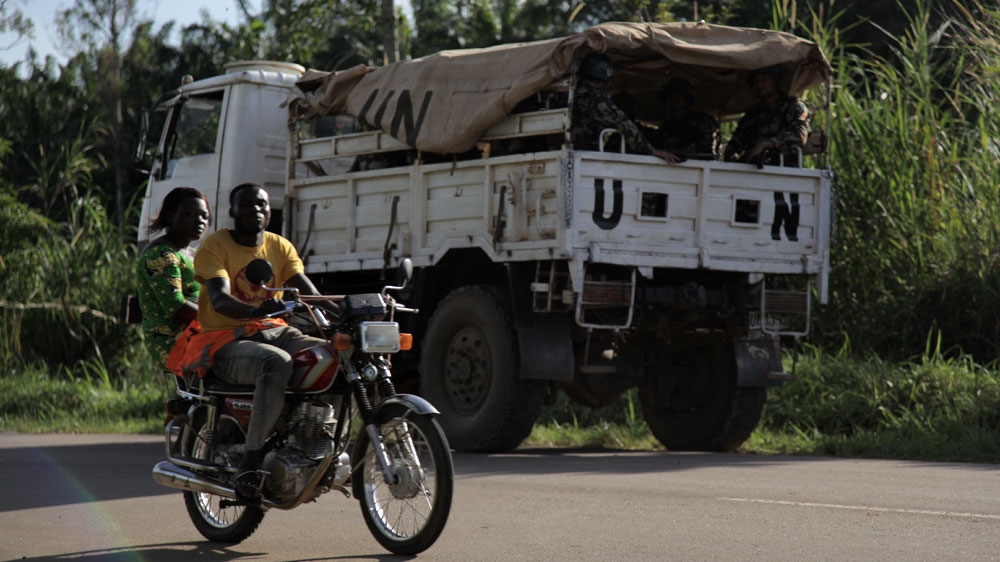 Nepalese peacekeepers stand guard along the N4, north of Beni city, North Kivu [Zahra Moloo/Al Jazeera] Early morning in Beni city, North Kivu [Zahra Moloo/Al Jazeera]Nepalese peacekeepers stand guard along the N4, north of Beni city, North Kivu [Zahra Moloo/Al Jazeera] The houses in this area of Kalongo district have been abandoned since May 2015 after an attack by suspected ADF fighters. Kalongo is located about 3km from the UN peacekeeping base in Mavivi, Beni territory, North Kivu. [Zahra Moloo/Al Jazeera] 