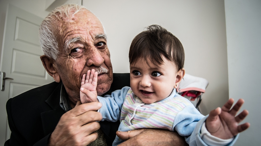 For Nouri, their return is a godsend. He had thought he would never see his son's children again [Pieter Stockmans/Al Jazeera]