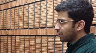 Iranian voter Ali Movahedian [Hamid Reza Gholamzadeh/Al Jazeera]