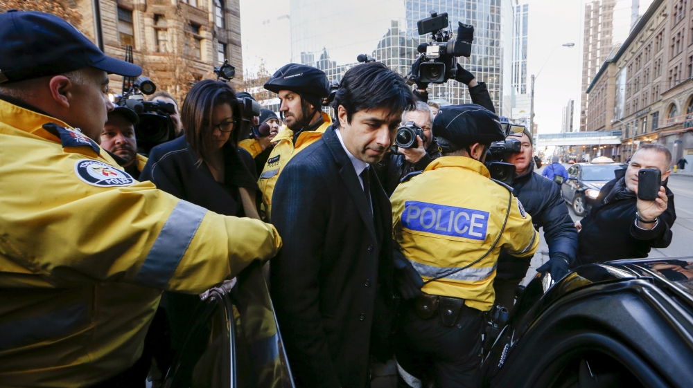 Ghomeshi leaving Trial