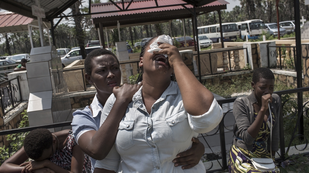 Girls cry during the funeral Gloris Burakuvye, 21, in Bujumbura on January 26, 2016. Burakuvye was allegedly executed by police on January 21, the same day a UN Security Council delegation arrived in the country [Will Baxter/Al Jazeera] 
