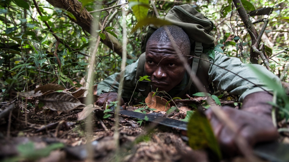 The rangers use skills acquired as hunters and soldiers to protect the forest against those who would destroy it [Aurelie Marrier d'Unienville/Al Jazeera]