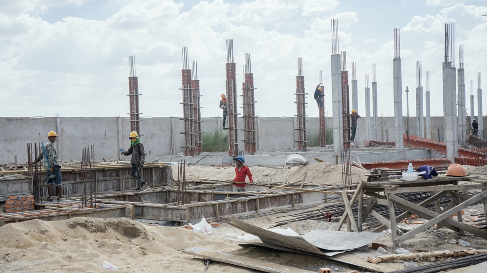 When their day at the construction site is over, many women must then take on household chores and childcare responsibilities [Hannah Reyes/Al Jazeera]