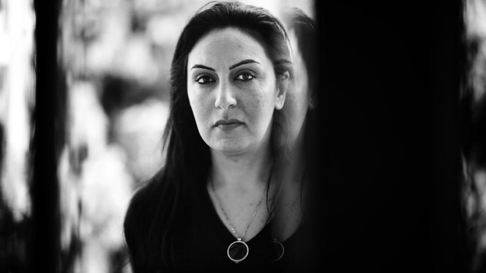 Rima al-Shami works as a cultural mediator in the Serbian transit camps of Presevo and Sid [Mona van den Berg/Al Jazeera]