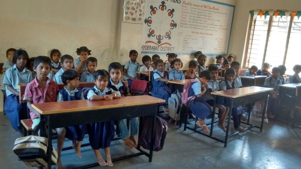 Unable to afford shoes or slippers, many children come to slum school barefoot [Mohd Abdul Alam/Al Jazeera]