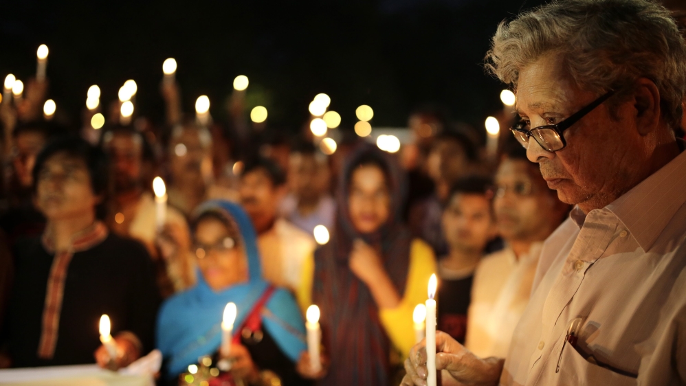The father of the writer-blogger Avijit Roy attends a candlelight vigil at the spot where his son was killed in Dhaka, Bangladesh [EPA]