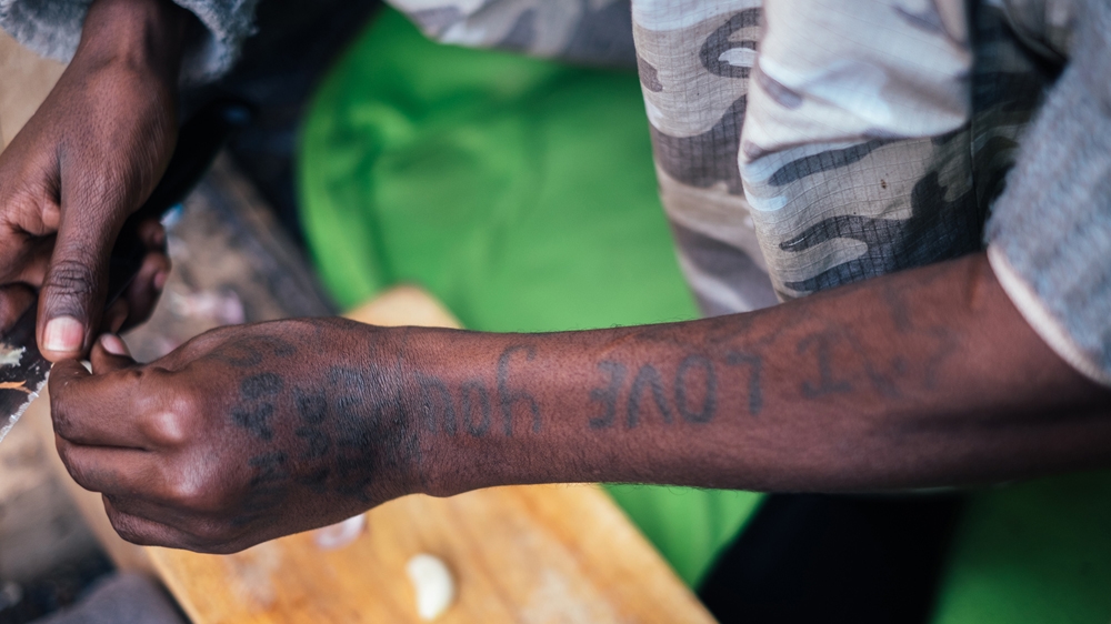 'I ran away from SAWA when I was 16 because it was too hard ... when I returned, they strung me up for days and tortured me,' Adam says [James Rippingale/Al Jazeera]