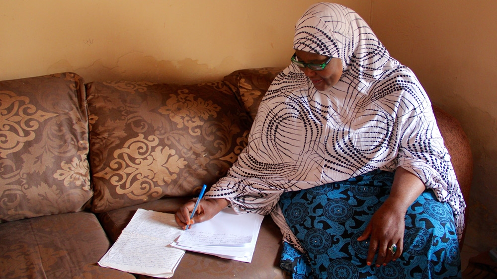 Balaraba Ramat Yakubu in writing mode [Femke van Zeijl/Al Jazeera] 