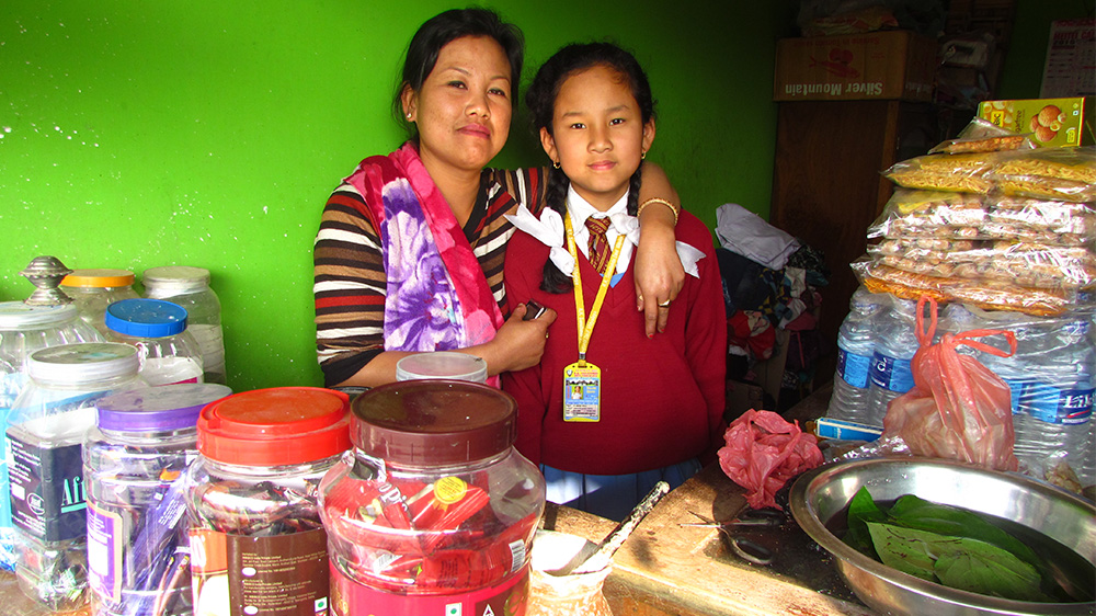 Edina Yaikhom with her daughter, Angelina, who was four when her father was killed in an alleged fake encounter in 2009 [Sarita Santoshini/Al Jazeera]