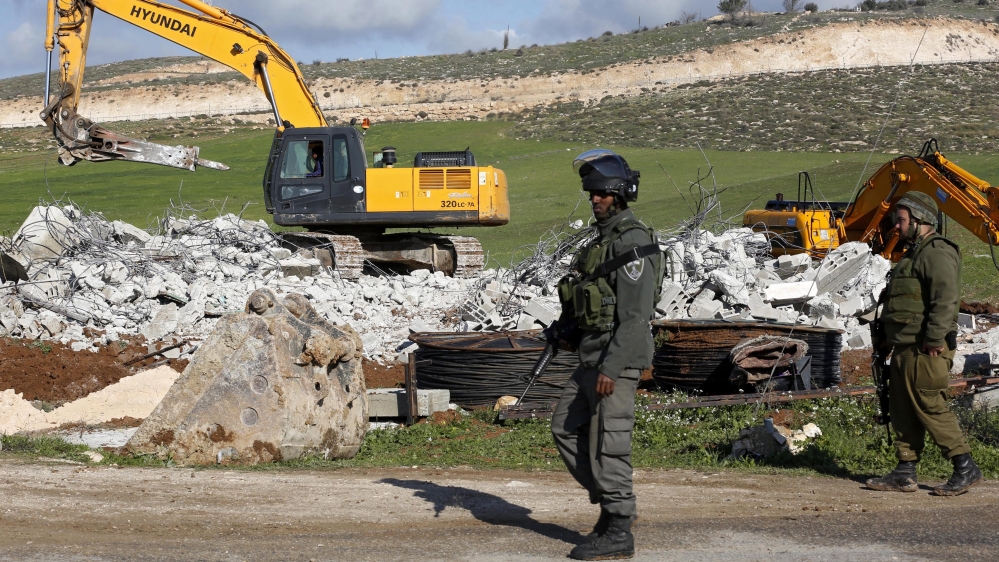 Demolishing a house in the West Bank