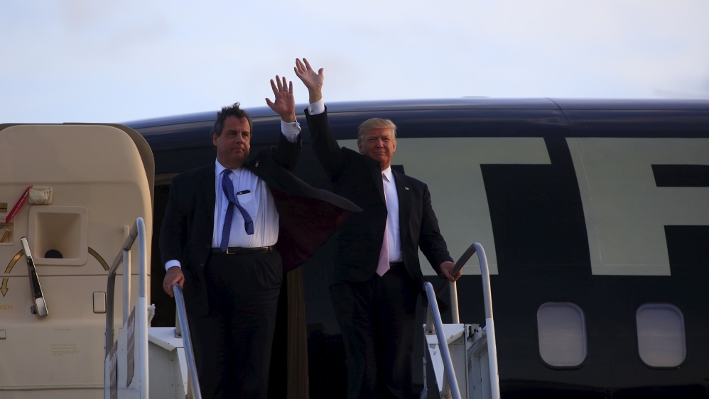 U.S. Republican presidential candidate Donald Trump arrives with Gov. Chris Christie (R-NJ) at a campaign rally at Winner Aviation in Youngstown, Ohio