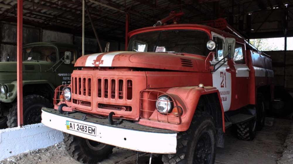 A fire truck in the exclusion zone [Christian Borys/Al Jazeera]